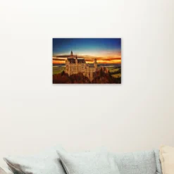 Kasteel met zonsondergang als sfeerimpressie aan de muur