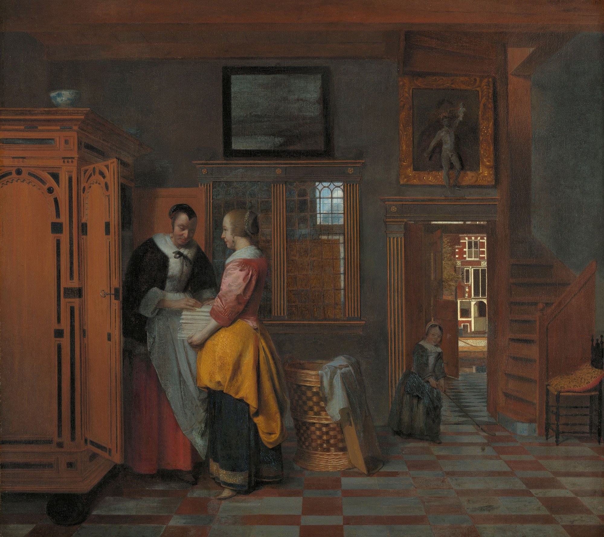 Binnenhuis met vrouwen bij een linnenkast van Pieter de Hooch: twee vrouwen leggen gevouwen linnen in een grote kast, met een doorkijk naar de straat